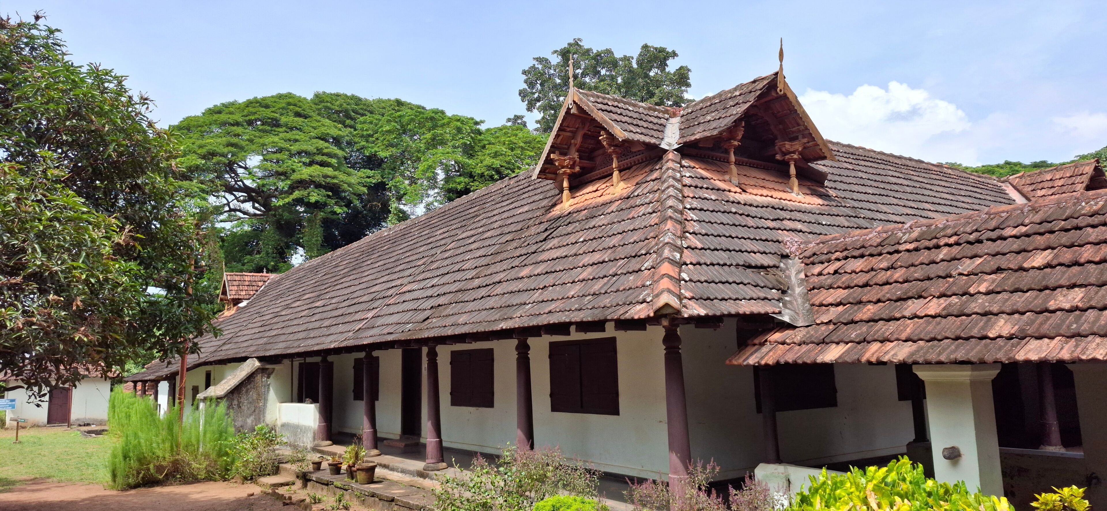 India kerala Sep 27 2024 Hill palace museum kerala Traditional Heritage Home with Distinct Wooden Roofing and Nature View