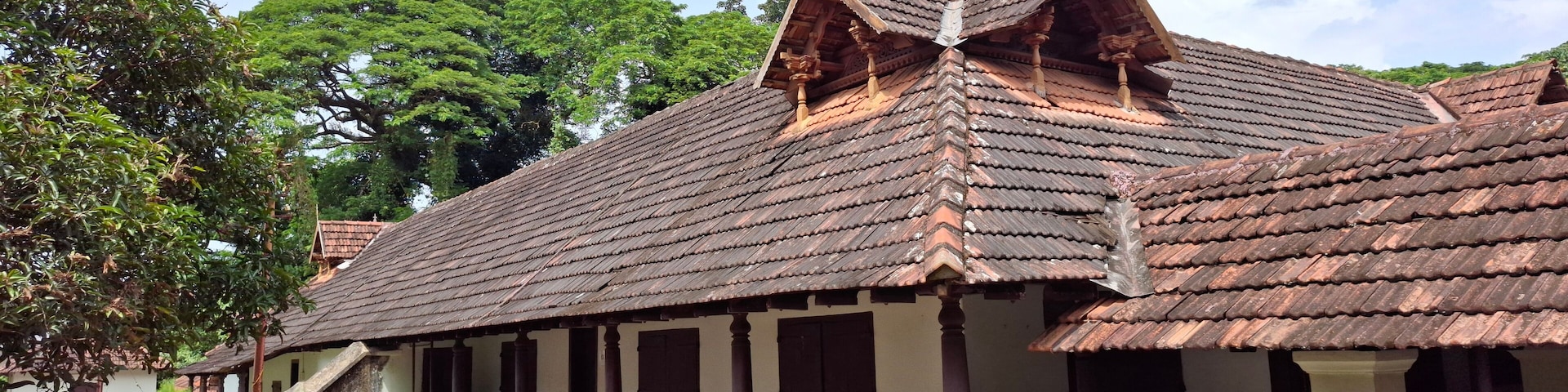 India kerala Sep 27 2024 Hill palace museum kerala Traditional Heritage Home with Distinct Wooden Roofing and Nature View