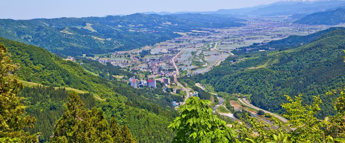Scene of Echigo Yuzawa city and mountain ranges in summer, views from Yuzawa Kogen.