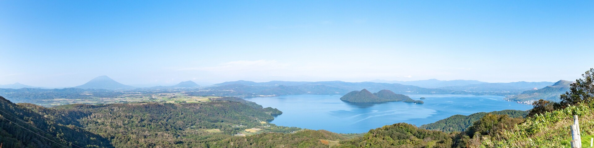 The whole view of Lake Toya. Panoramic image. Hokkaido, Japan
