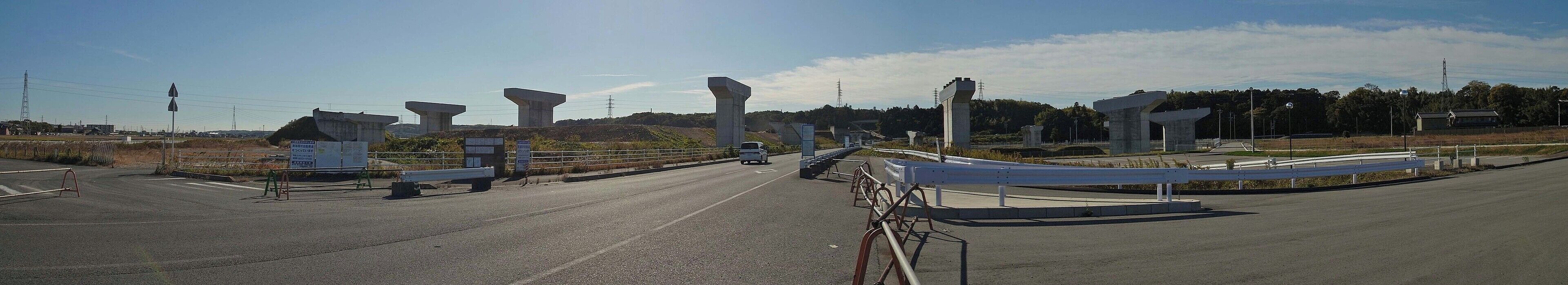 A highway with multiple overpasses and a pedestrian walkway.