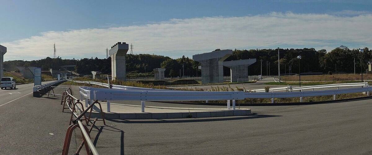 A highway with multiple overpasses and a pedestrian walkway.