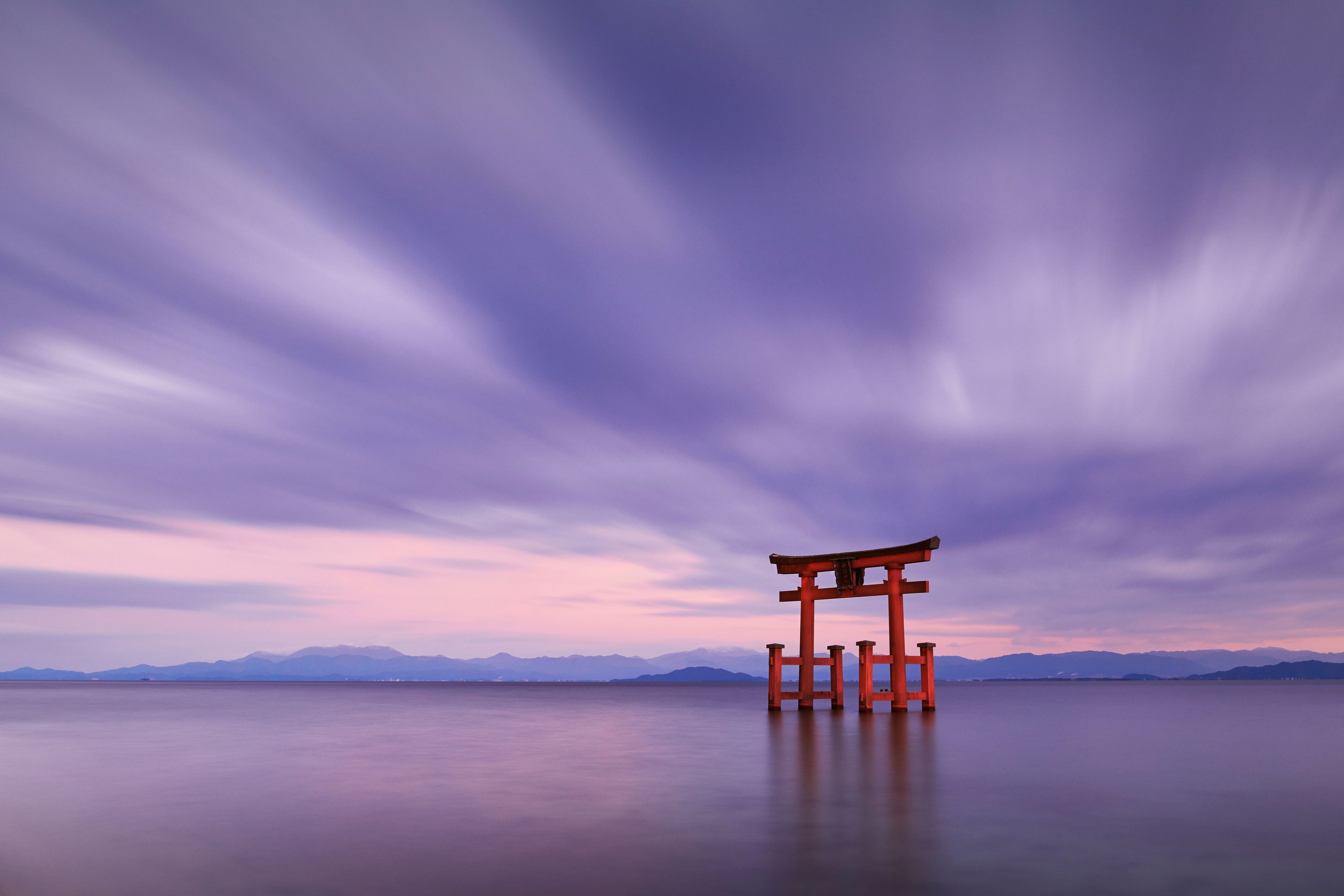 Long exposure shot of Shirahige shrine Torii gate at sunset at Lake Biwa, Shiga Prefecture, Japan