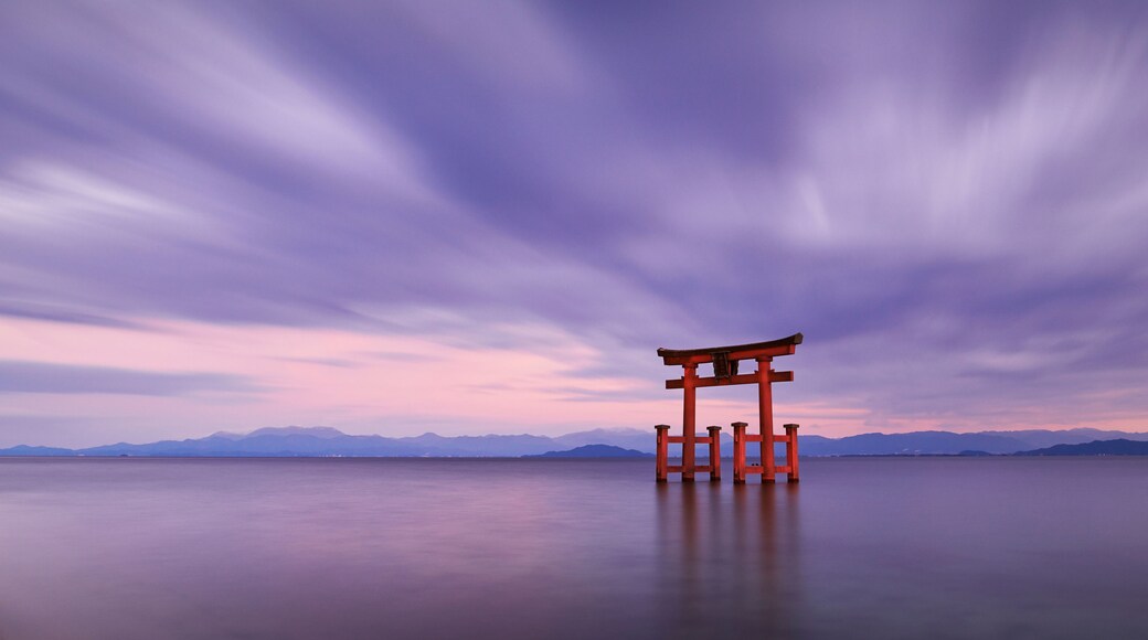 Long exposure shot of Shirahige shrine Torii gate at sunset at Lake Biwa, Shiga Prefecture, Japan