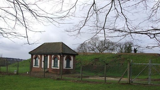 Covered Reservoir, Little Brickhill There are two covered reservoirs here, south-east of the village of Little Brickhill. The one seen here is the further from the village. In front of it can be seen 313264 which presumably contains control equipment for the reservoirs.
