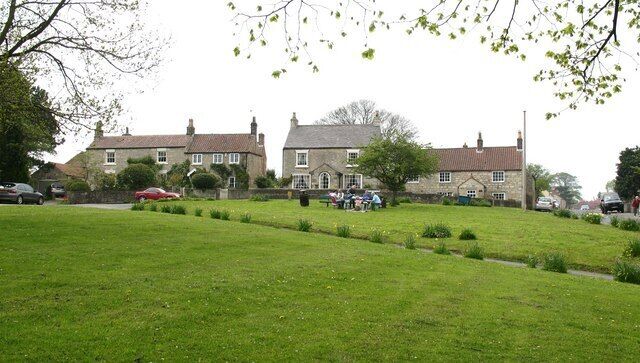 Picnic on the green The village green at Burton Leonard on a pleasant spring day.