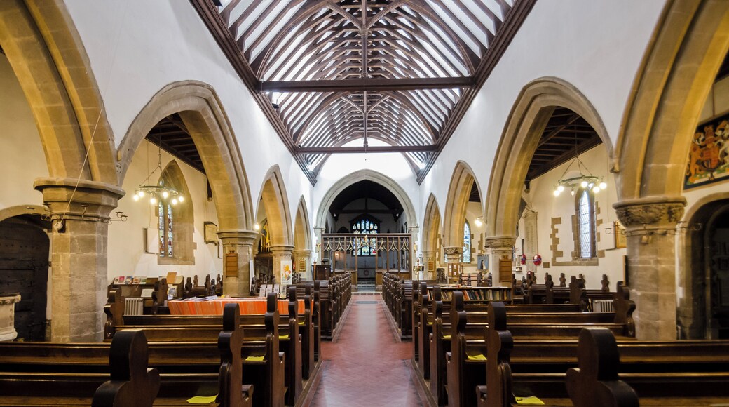 Balderton dates back to Saxon times, and it is known that Lady Godiver the wife of Earl Leofric had property nearby. In the past the Great North Road from London to York passed through the village. There is no trace of an original Saxon church, although one probably existed. The church dates from the 12th century when a simple building, some of which still remains in the nave, was constructed. The north and south doorways still retain Norman arches with zigzag patterning (although both have been moved from their original position). The church consists of a tower with spire, nave with north and south aisles, north and south porches, and a chancel with north Chapel which houses the organ. The tower dates from the 13th century and is of three stages. It was encased in ashlar in the 1880s. The top is embattled with pinnacles and gargoyles. The spire dates from circa 1400 and is crocketted with lucarnes. There are 8 bells. The nave has four bay arcades with octagonal piers. In the 13th century the north aisle was added and a larger chancel was built. Shortly after, the nave was extended westward, and the building of the tower commenced, this was delayed by the Black Death of 1347. The south aisle was added in the 14th century. The font also dates from this time. It is octagonal, with ball flower ornamentation. Around this time a clerestory was added, which was later removed in Victorian times. The screen dates from the 15th century and it was originally brightly painted and had panels of Biblical scenes. Evidence of the stonework supporting the rood loft was removed during restoration in 1882. In the late 15th century the pews were installed. These have carved poppy heads depicting animals and other figures, one man is playing Lincolnshire bagpipes. There are also undecorated 19th-century pews. The pulpit is from around 1475 and was previously on the south side of the chancel arch but was moved in 1882. The north door with its wicket is of the same 15th century period. The Victorian restoration of the church took place in 1882, when the nave roof was altered and the clerestory removed. The chancel roof had already been replaced in 1850, and additional pews were installed. The north porch was rebuilt incorporating the Norman arch. In 1929 cracks were found in the tower wall and major repairs to the foundations were undertaken. A new vestry was constructed in 1964 on the south side of the church. In 1983 the chancel was encased in Ancaster stone, matching the rest of the church. There are several 19th-century stained-glass windows and some reset fragments of 15th century glass which were found in the churchyard.