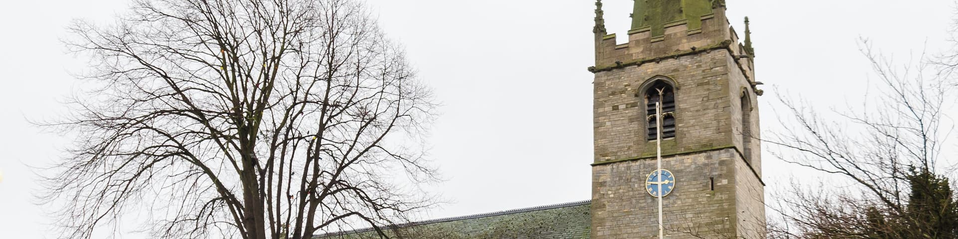 Balderton dates back to Saxon times, and it is known that Lady Godiver the wife of Earl Leofric had property nearby. In the past the Great North Road from London to York passed through the village. There is no trace of an original Saxon church, although one probably existed. The church dates from the 12th century when a simple building, some of which still remains in the nave, was constructed. The north and south doorways still retain Norman arches with zigzag patterning (although both have been moved from their original position). The church consists of a tower with spire, nave with north and south aisles, north and south porches, and a chancel with north Chapel which houses the organ. The tower dates from the 13th century and is of three stages. It was encased in ashlar in the 1880s. The top is embattled with pinnacles and gargoyles. The spire dates from circa 1400 and is crocketted with lucarnes. There are 8 bells. The nave has four bay arcades with octagonal piers. In the 13th century the north aisle was added and a larger chancel was built. Shortly after, the nave was extended westward, and the building of the tower commenced, this was delayed by the Black Death of 1347. The south aisle was added in the 14th century. The font also dates from this time. It is octagonal, with ball flower ornamentation. Around this time a clerestory was added, which was later removed in Victorian times. The screen dates from the 15th century and it was originally brightly painted and had panels of Biblical scenes. Evidence of the stonework supporting the rood loft was removed during restoration in 1882. In the late 15th century the pews were installed. These have carved poppy heads depicting animals and other figures, one man is playing Lincolnshire bagpipes. There are also undecorated 19th-century pews. The pulpit is from around 1475 and was previously on the south side of the chancel arch but was moved in 1882. The north door with its wicket is of the same 15th century period. The Victorian restoration of the church took place in 1882, when the nave roof was altered and the clerestory removed. The chancel roof had already been replaced in 1850, and additional pews were installed. The north porch was rebuilt incorporating the Norman arch. In 1929 cracks were found in the tower wall and major repairs to the foundations were undertaken. A new vestry was constructed in 1964 on the south side of the church. In 1983 the chancel was encased in Ancaster stone, matching the rest of the church. There are several 19th-century stained-glass windows and some reset fragments of 15th century glass which were found in the churchyard.