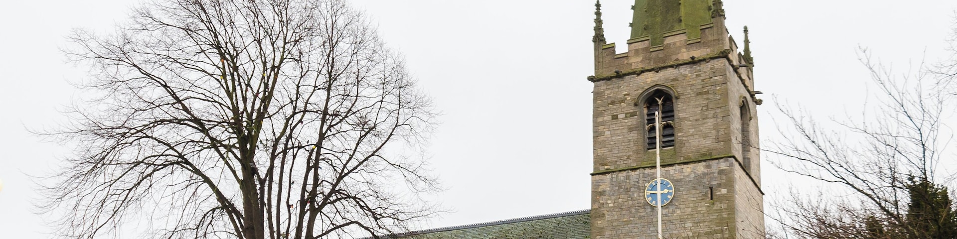 Balderton dates back to Saxon times, and it is known that Lady Godiver the wife of Earl Leofric had property nearby. In the past the Great North Road from London to York passed through the village. There is no trace of an original Saxon church, although one probably existed. The church dates from the 12th century when a simple building, some of which still remains in the nave, was constructed. The north and south doorways still retain Norman arches with zigzag patterning (although both have been moved from their original position). The church consists of a tower with spire, nave with north and south aisles, north and south porches, and a chancel with north Chapel which houses the organ. The tower dates from the 13th century and is of three stages. It was encased in ashlar in the 1880s. The top is embattled with pinnacles and gargoyles. The spire dates from circa 1400 and is crocketted with lucarnes. There are 8 bells. The nave has four bay arcades with octagonal piers. In the 13th century the north aisle was added and a larger chancel was built. Shortly after, the nave was extended westward, and the building of the tower commenced, this was delayed by the Black Death of 1347. The south aisle was added in the 14th century. The font also dates from this time. It is octagonal, with ball flower ornamentation. Around this time a clerestory was added, which was later removed in Victorian times. The screen dates from the 15th century and it was originally brightly painted and had panels of Biblical scenes. Evidence of the stonework supporting the rood loft was removed during restoration in 1882. In the late 15th century the pews were installed. These have carved poppy heads depicting animals and other figures, one man is playing Lincolnshire bagpipes. There are also undecorated 19th-century pews. The pulpit is from around 1475 and was previously on the south side of the chancel arch but was moved in 1882. The north door with its wicket is of the same 15th century period. The Victorian restoration of the church took place in 1882, when the nave roof was altered and the clerestory removed. The chancel roof had already been replaced in 1850, and additional pews were installed. The north porch was rebuilt incorporating the Norman arch. In 1929 cracks were found in the tower wall and major repairs to the foundations were undertaken. A new vestry was constructed in 1964 on the south side of the church. In 1983 the chancel was encased in Ancaster stone, matching the rest of the church. There are several 19th-century stained-glass windows and some reset fragments of 15th century glass which were found in the churchyard.