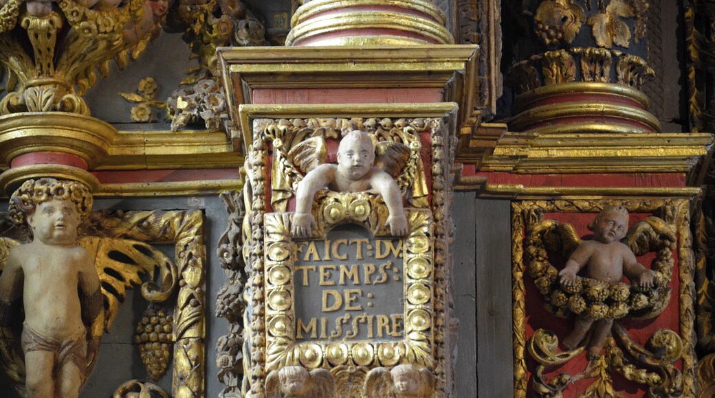 Inside of the church of Saint-Derrien (in common Commana, located in Brittany in western France). The south transept houses the "altar of the Five Wounds." At the bottom of the church, a baptistery basin of stone is topped by a high dai including wood carvings decorated with feminine virtues (temperance, justice ...).