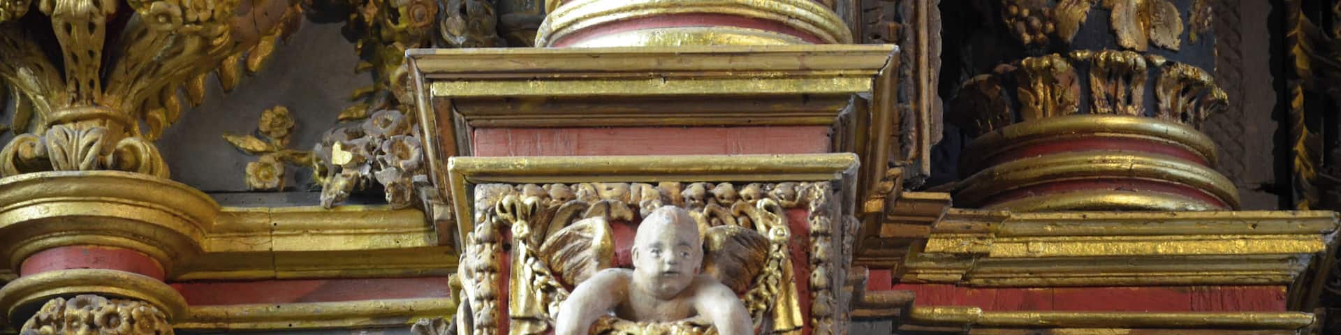 Inside of the church of Saint-Derrien (in common Commana, located in Brittany in western France). The south transept houses the "altar of the Five Wounds." At the bottom of the church, a baptistery basin of stone is topped by a high dai including wood carvings decorated with feminine virtues (temperance, justice ...).