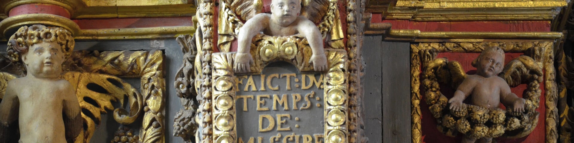 Inside of the church of Saint-Derrien (in common Commana, located in Brittany in western France). The south transept houses the "altar of the Five Wounds." At the bottom of the church, a baptistery basin of stone is topped by a high dai including wood carvings decorated with feminine virtues (temperance, justice ...).