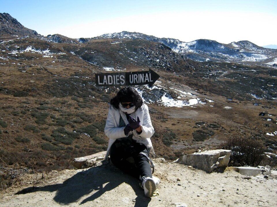 #Snow
I had to take this photo. It was too funny,my friend was so tired of climbing steps that she sat under this awesome sign without realising where she sat. 