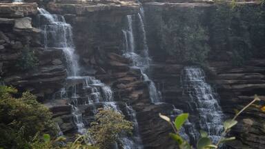 Landscape view of beautiful waterfall in Mirzapur, Uttar Pradesh, India with selective focus. Beautiful tourist spot at Tanda waterfall in Mirzapur with copy space.