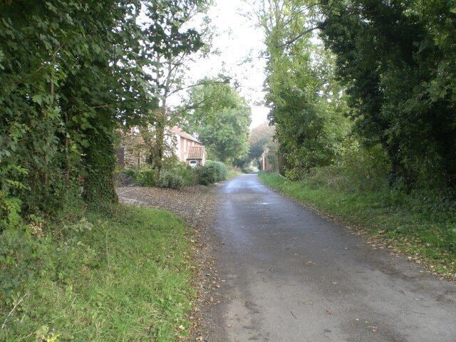 Rougham End View to the east with the garden wall of Weasenham Hall on the right in the distance.