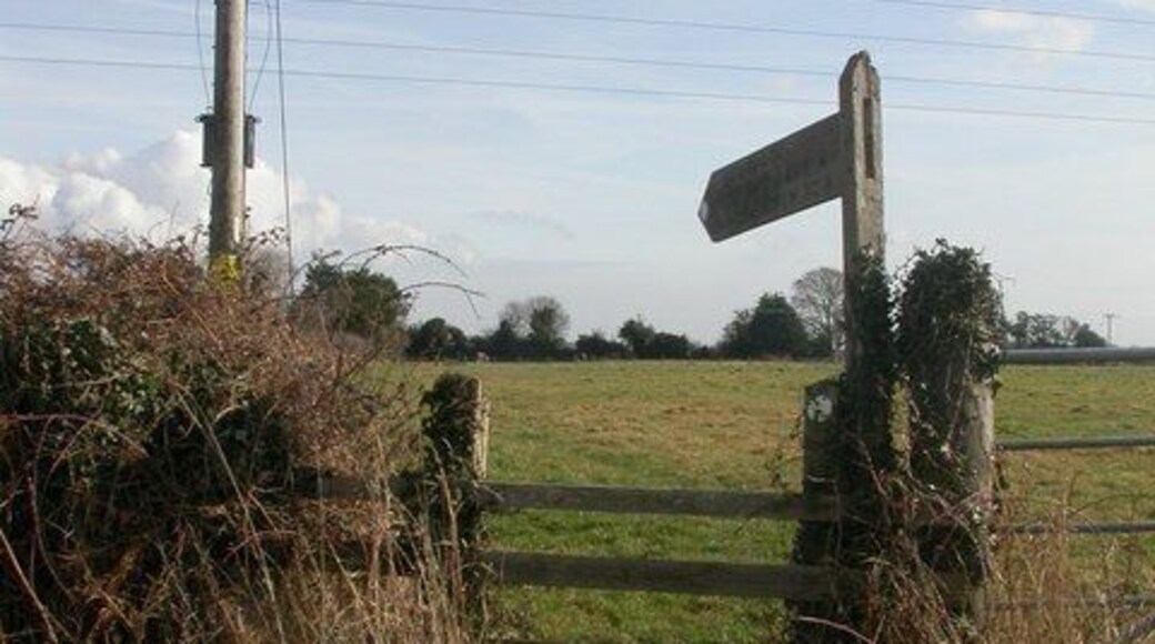 West Parley, footpath signpost. Signpost pointing the way from Church Lane 1171549 to Woodtown Farm 1171566, whence on to Christchurch Road.
