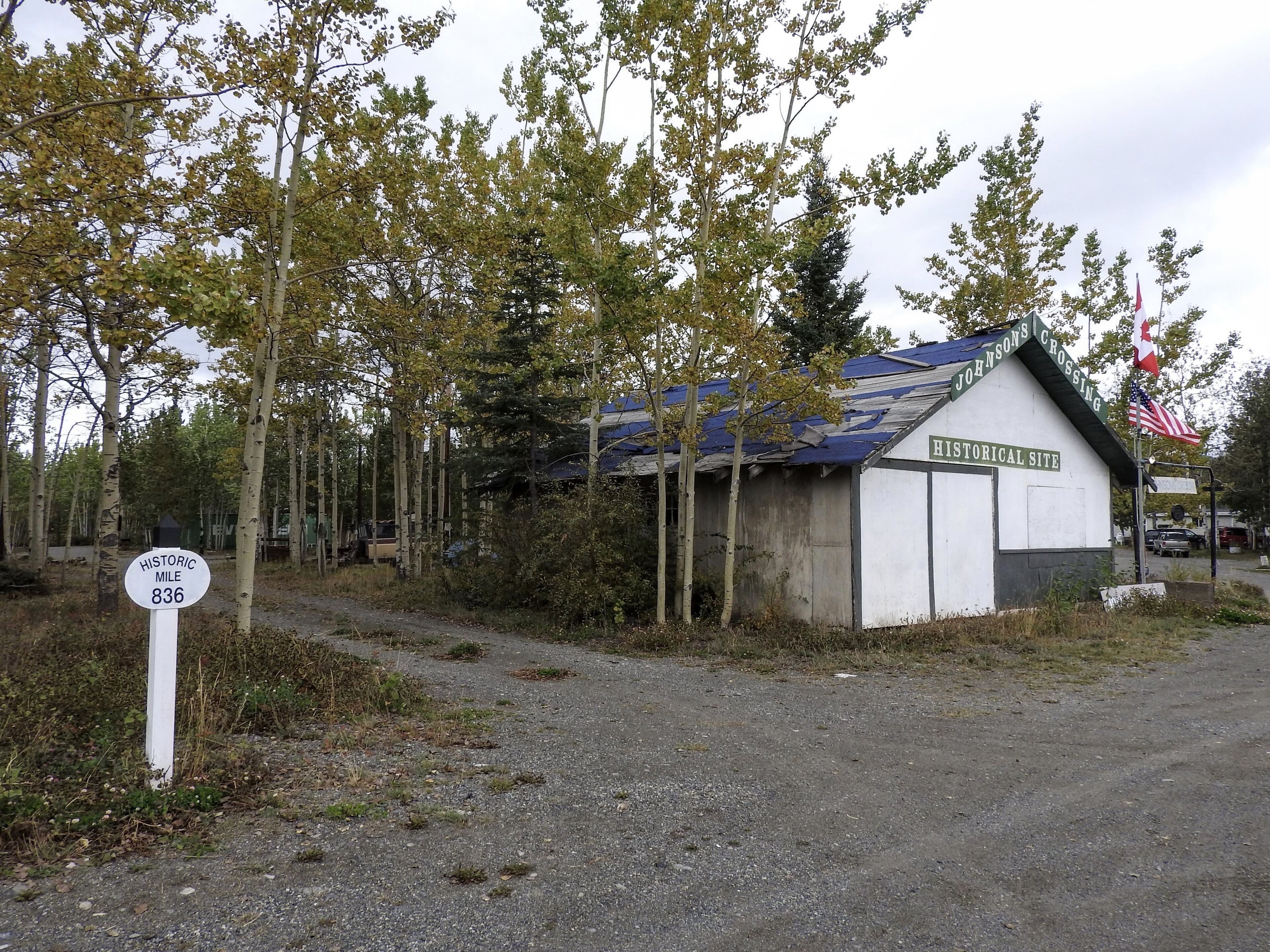 A historic site at Johnsons Crossing, marked by a sign indicating mile 836.