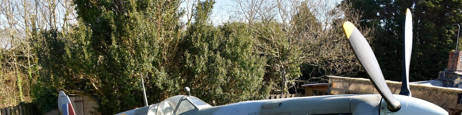 This spit replica park up next to house in a parking lay-by at the end of the runway at Newquay airport