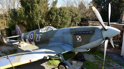 This spit replica park up next to house in a parking lay-by at the end of the runway at Newquay airport