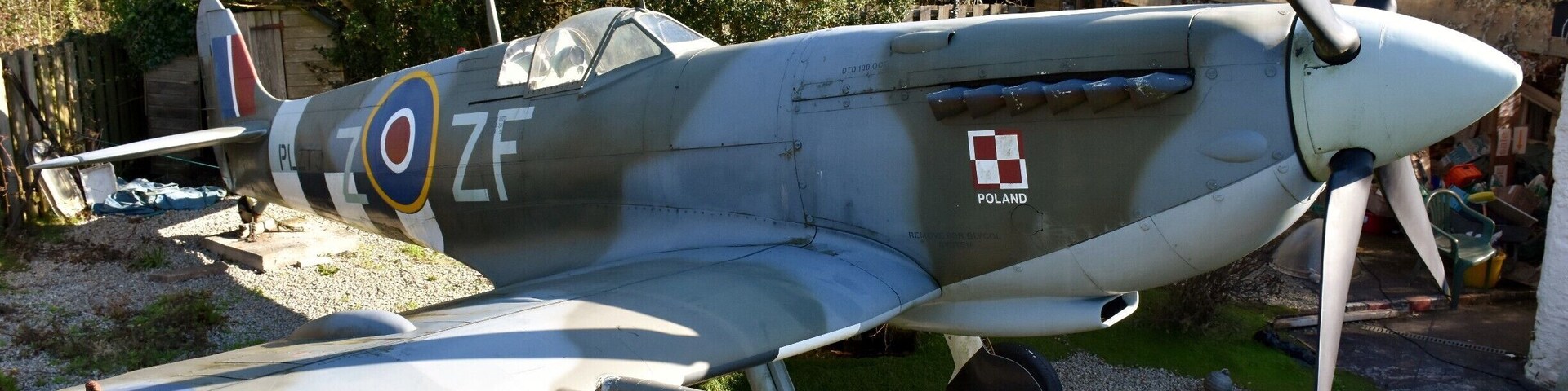 This spit replica park up next to house in a parking lay-by at the end of the runway at Newquay airport