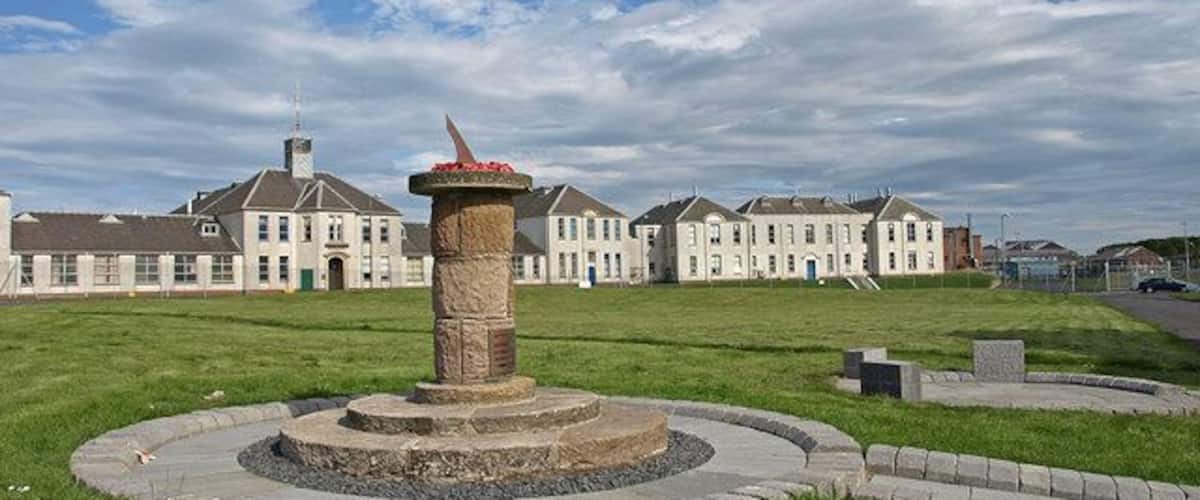 Nobel Business Park War memorial to the Ardeer employees who gave their lives during the Second World War. McGowan House in the background is office accommodation.