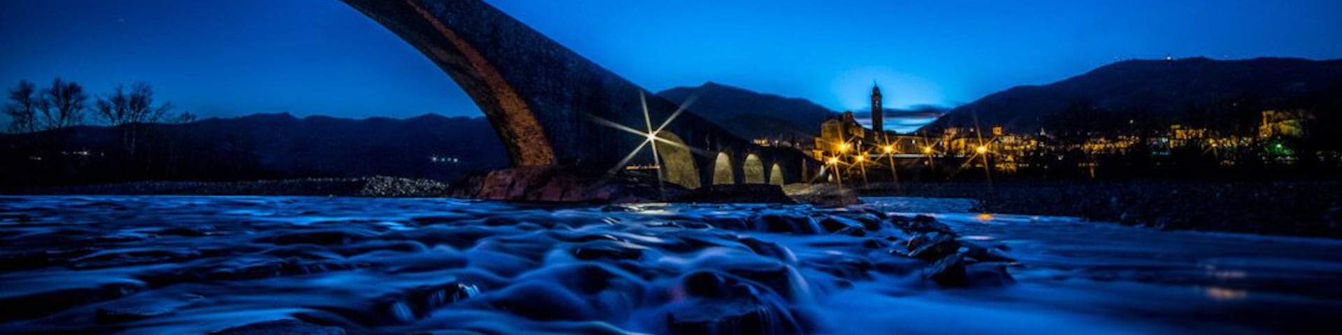 To avoid the risks of Trebbiaโs unpredictable floods, legend has it that St. Columban made a pact with the Devil: in exchange for the construction of the bridge in one night only, Devilโs reward would be the soul of the first person who would cross it. The Devil respected the agreement and in one night he built the Old Bridge with the help of a group of demons of different height and build, cause however of the structureโs irregularity. When St. Columbanus, the next morning, saw the Hunchbacked Bridge, mocked the Devil by letting a dog be the first to cross it.
#blue