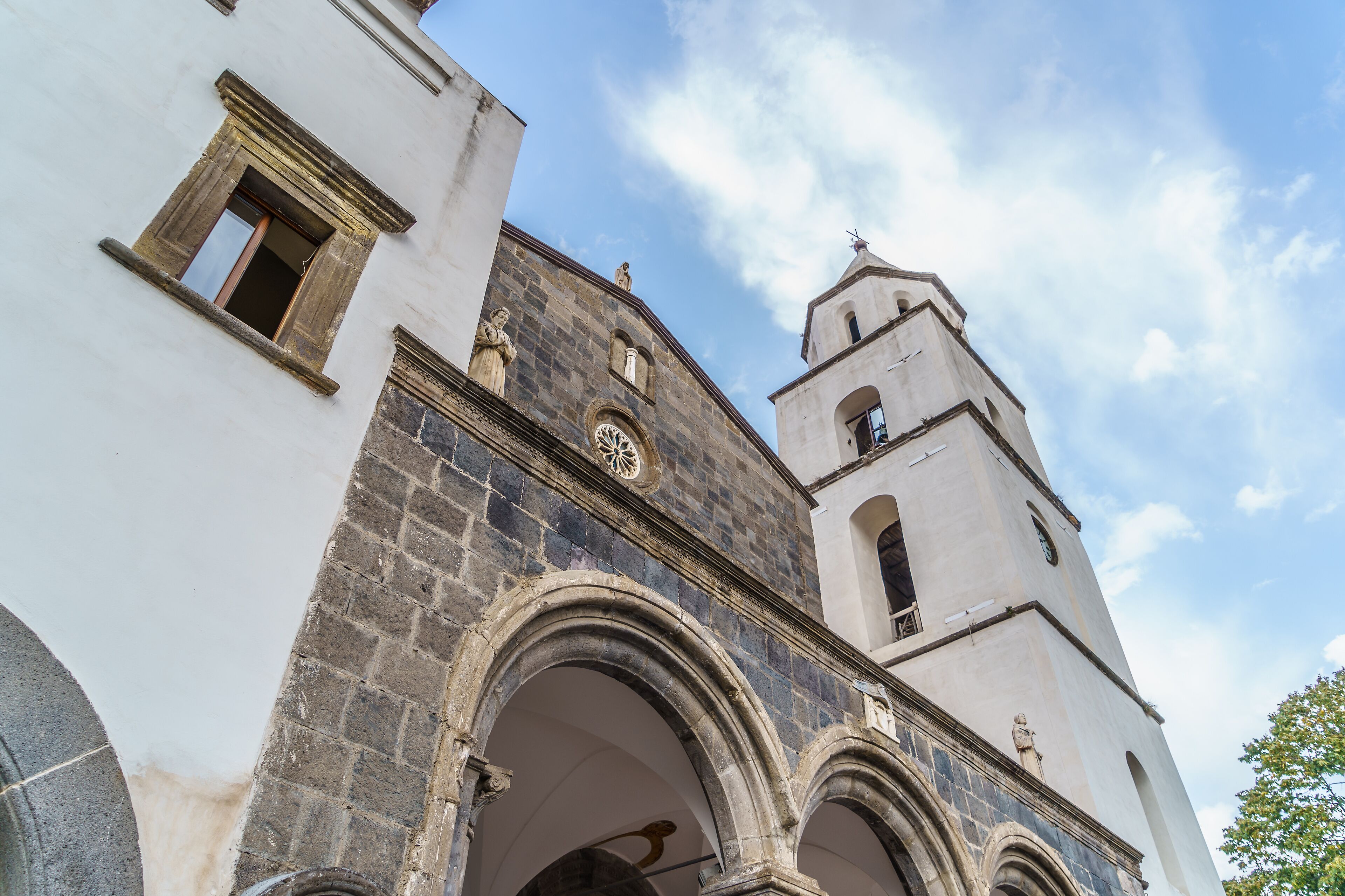 A historic church with a clock tower and arched windows.