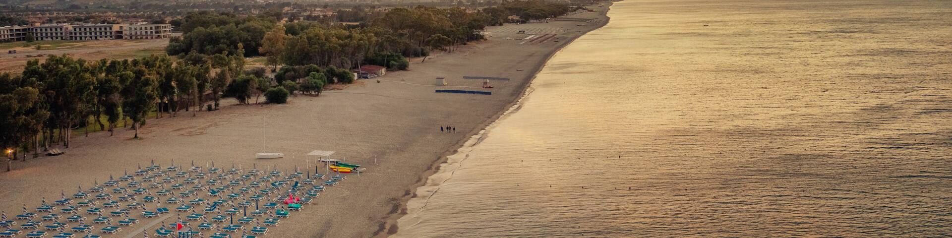 Aerial view of beautiful sea and beach sunrise, seascape and hill mountain on backgrond, Simeri Mare, Calabria, Southern Italy