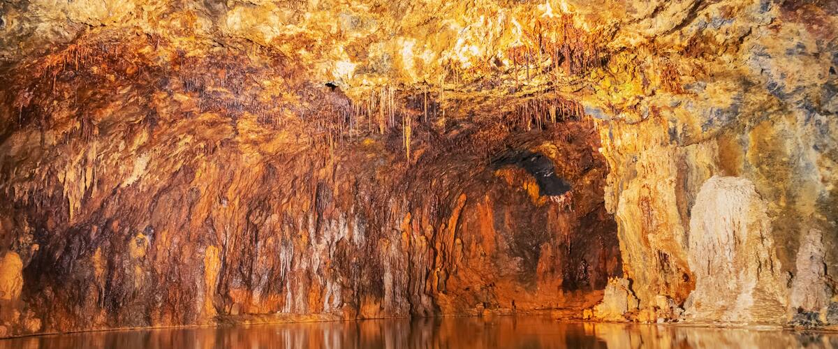 Iron and other minerals reflecting in satin colored water in the colorful Fairy Grottoes in Saalfeld