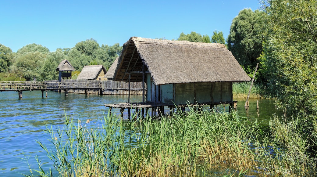 Hornstaad House and in the background the Stone Age Village Sipplingen, Pfahlbaumuseum Unteruhldingen, Uhldingen-Mühlhofen, Lake Constance, Germany
