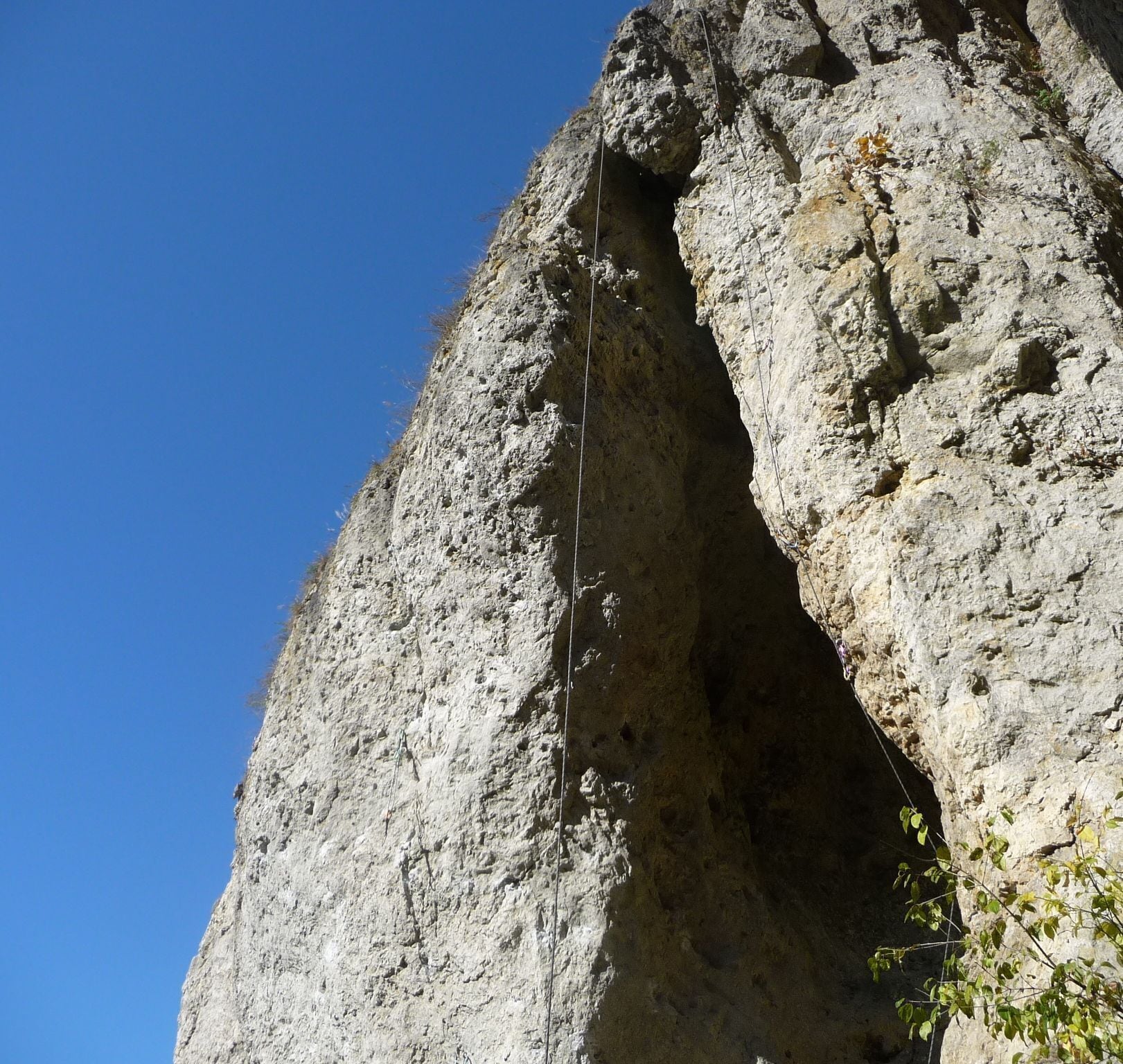 A rocky cliff with a climbing route.
