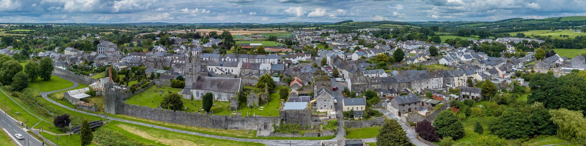 Aerial view of Fethard old medieval walled town in County Tipperary on the Clashawley River with Gothic Church and mural tower house