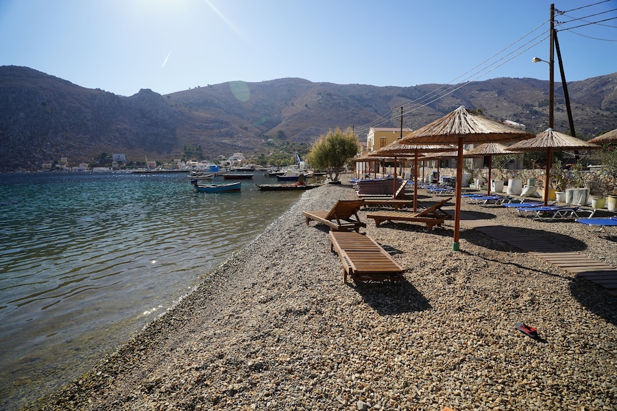 sunbeds and sunshades on the beach of Pedi , Greece