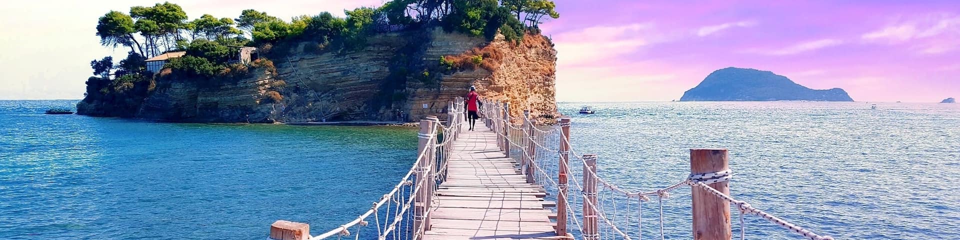 This is Cameo Island. A small private island off the shore of Laganas which is often used for weddings as it offers a romantic atmosphere and stunning views of the Ionian Sea.