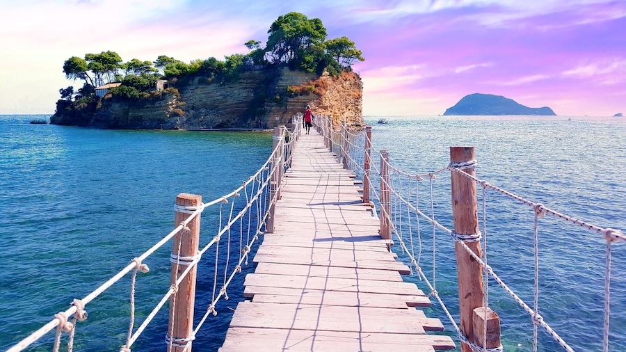 This is Cameo Island. A small private island off the shore of Laganas which is often used for weddings as it offers a romantic atmosphere and stunning views of the Ionian Sea.