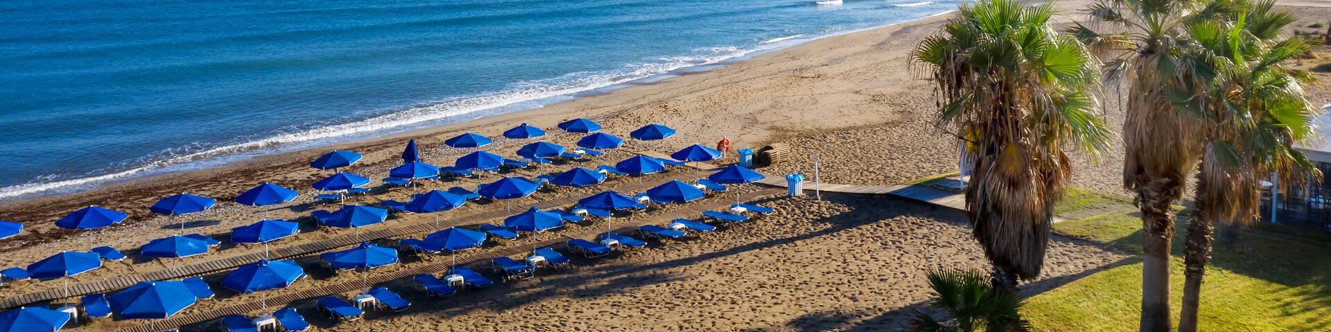 Amazing beach with umbrellas, Crete island, Greece.