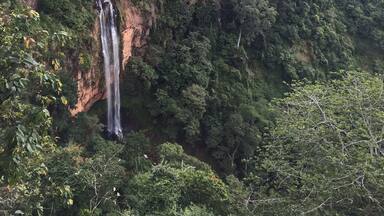 Waterfall hikes up to Livingstonia, Malawi. You can also stand at the top of the falls and in a cave behind them