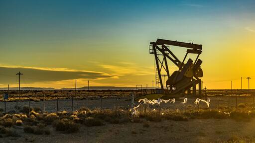 Sunset scene from road with oil machine at outdoor in argentinian patagonia, Santa Cruz province