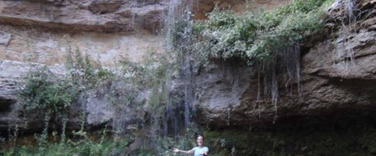 A waterfall cascading down a rocky cliff.