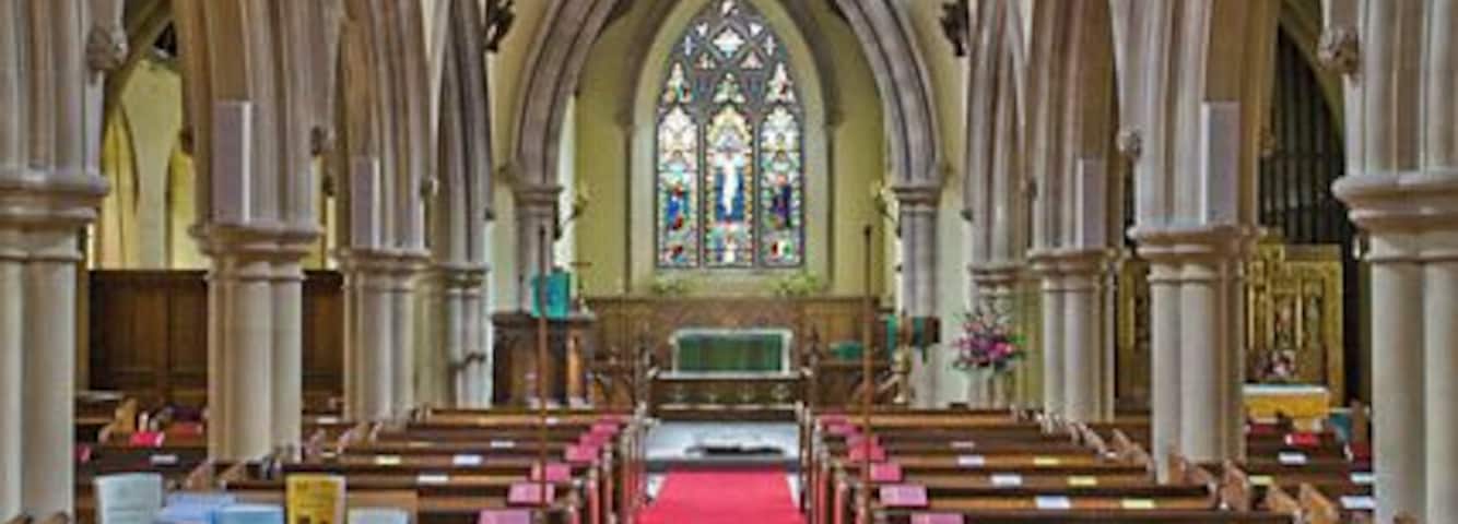 Interior of All Saints Church, Hursley The church is actually quite dark. This is a combination of two exposures to retain detail in the east window.
