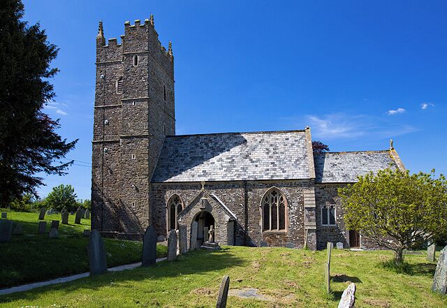 A historic church with a tall tower and arched windows.