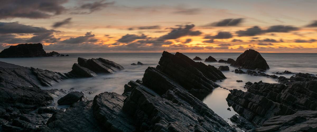 Hartland quay sunset north devon coast beach england panorma
