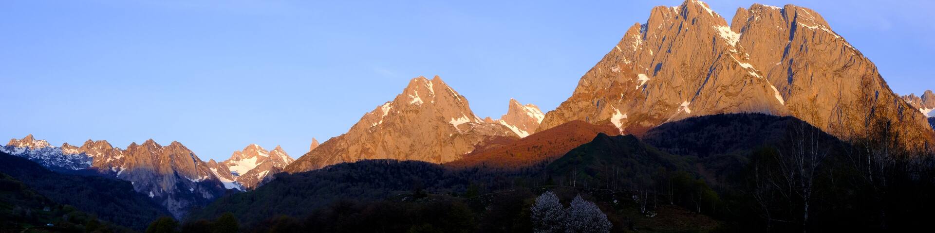 Billare. Sun rays at sunrise over the Grand Billare mountain in the cirque of Lescun, Aspe valley, France.