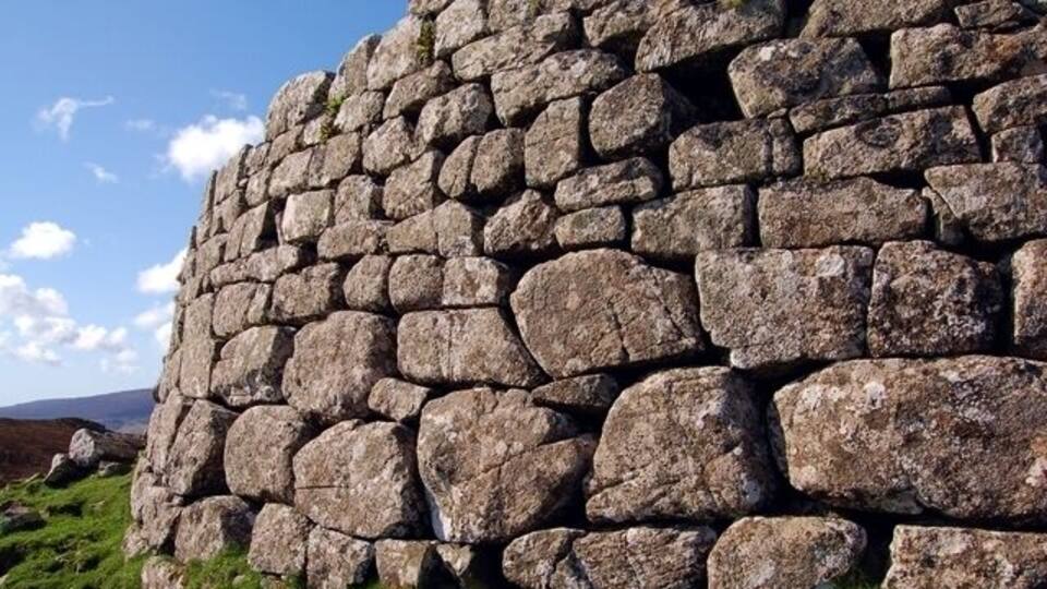 Iron Age wall A close view of part of the outer wall of Dun Hallin. The wall is 4m tall.