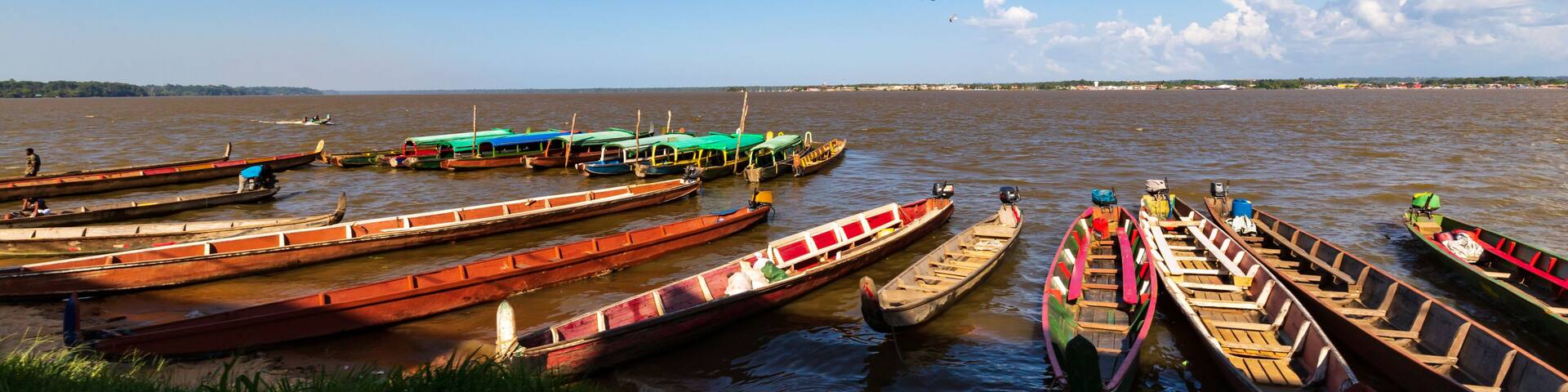 Colorful Small Wooden Ferry Boats At The Suriname French Guiana Border In Albina