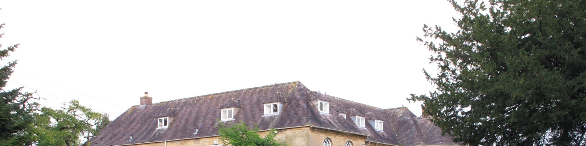 Upper Court, Kemerton. The house has extensive outbuildings converted as self-catering accommodation, and large lawns on which a marquee is pitched when weddings are held at the house. Upper Court was the main location for the Father Brown episode "The Three Tools of Death".