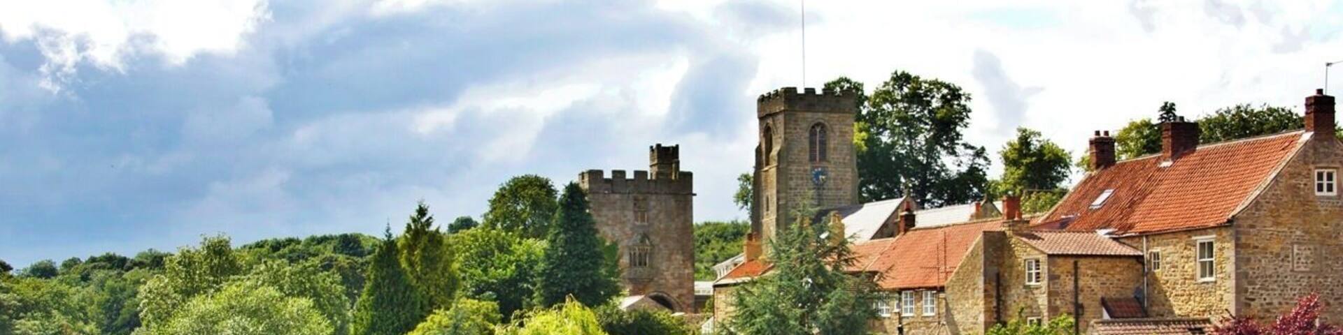 River Ure, West Tanfield View of River Ure and the village from the road bridge, The village church and Marmion Tower can be seen in the middle background