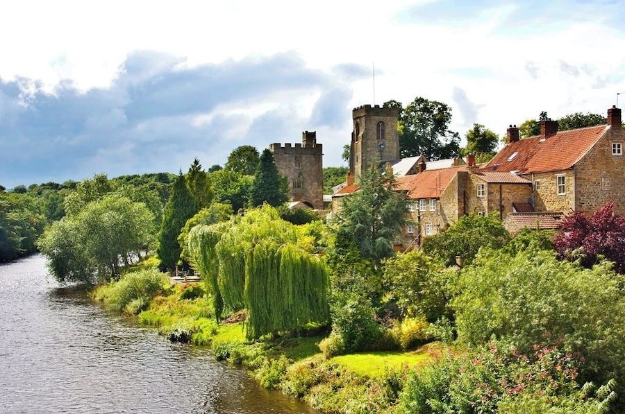 River Ure, West Tanfield View of River Ure and the village from the road bridge, The village church and Marmion Tower can be seen in the middle background