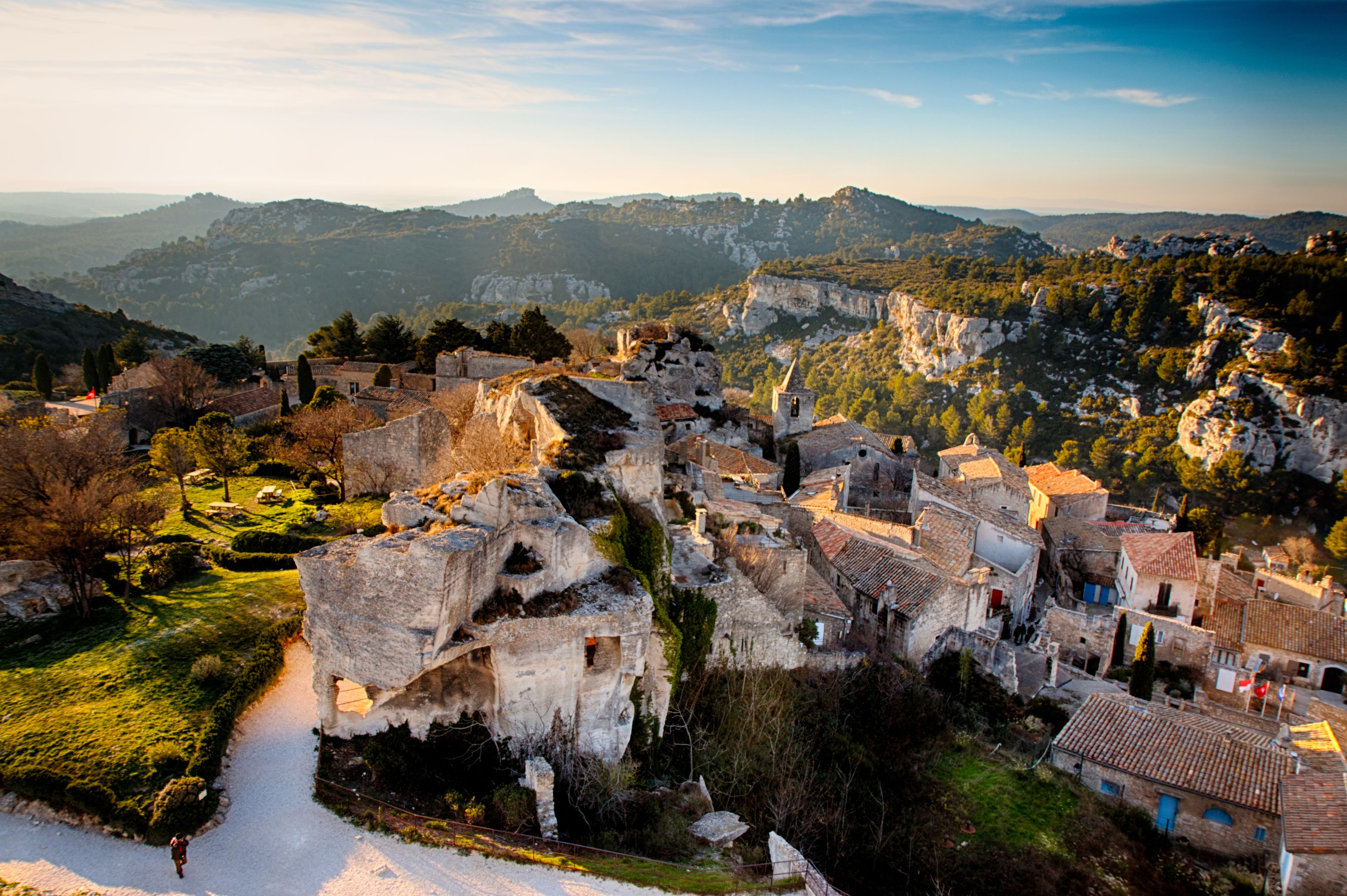 A historic town nestled in a valley with ancient ruins and traditional buildings.