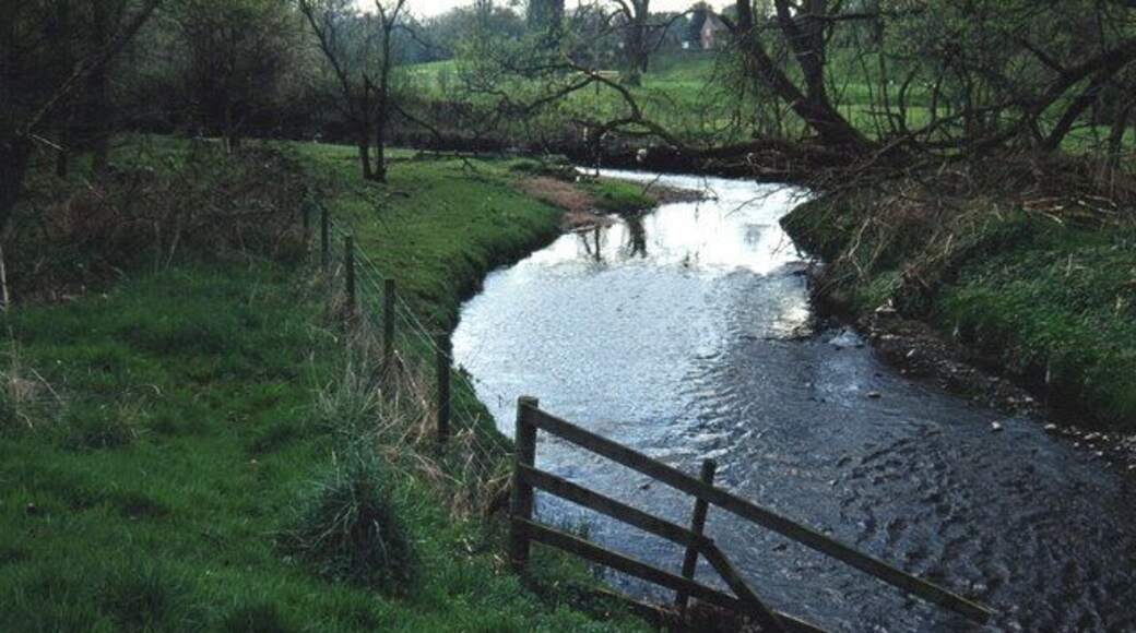 River Bollin below Prestbury. Looking upstream towards Prestbury. A footpath leads along the right hand bank of the river from this point into Prestbury.